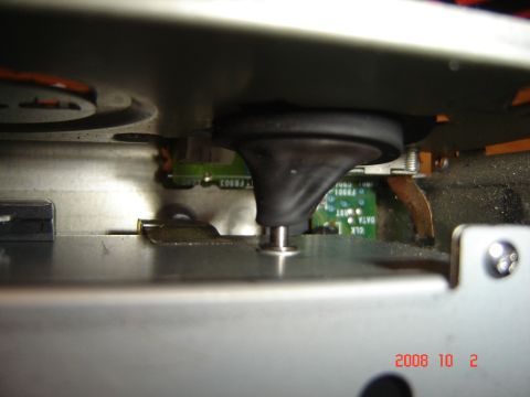 1993 Ford Bronco - Close-up view of a CD changer mechanism, showing internal components and a circuit board.