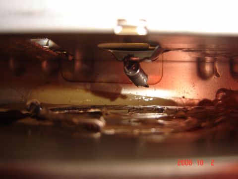 1993 Ford Bronco - Spark plug and wiring visible in a grimy engine compartment. Date: 2008 10 2.