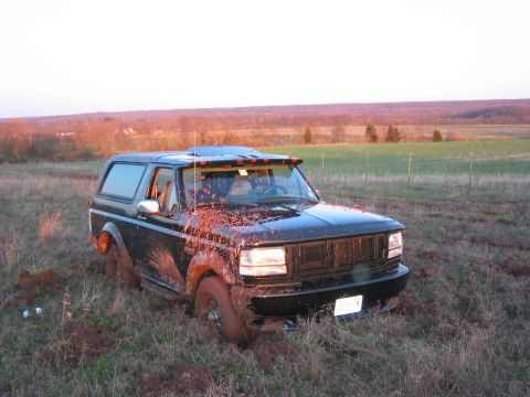 1994 Ford Bronco - Here I am nice and stuck. Those two water bottles, to the left of the truck, were used to put out the dry grass that had started to catch o…