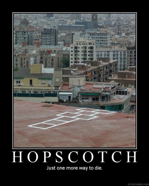 Rooftop hopscotch court with city buildings behind it
