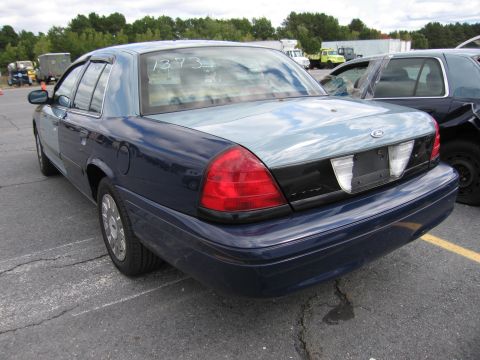 1991 Ford LTD Crown Victoria - Rear view of a Ford Crown Victoria, showing its distinctive taillights and trunk design.