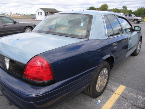 1991 Ford LTD Crown Victoria - This Ford Crown Victoria has a two-tone paint job with a dark blue and light blue color scheme.