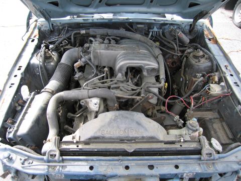 1991 Ford LTD Crown Victoria - Engine bay of a 1991 Ford Crown Victoria LTD, showing the engine and surrounding components under the hood.