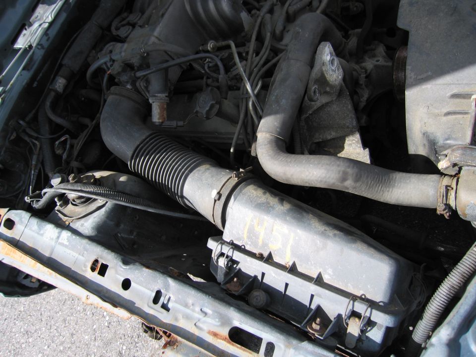Engine bay with air intake hose and engine components