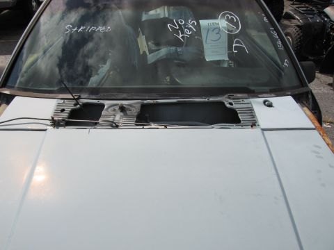 1991 Ford LTD Crown Victoria - Front view of a car with a stripped interior, showing the hood and windshield.