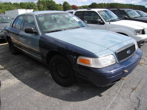 1991 Ford LTD Crown Victoria - This Ford Crown Victoria has a two-tone paint job and appears to be from the early 2000s.