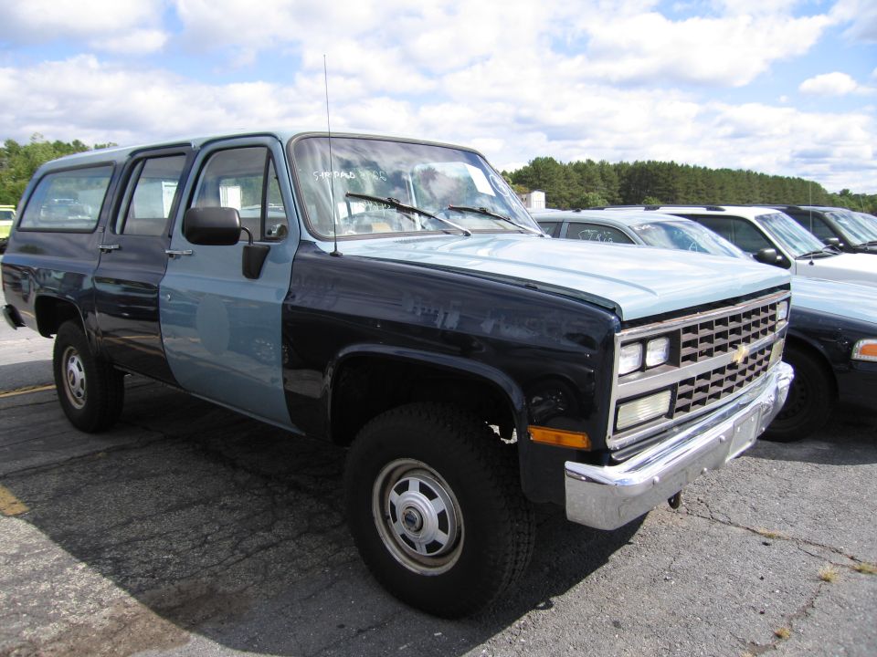 Two-tone SUV, front quarter view. Black and light blue paint