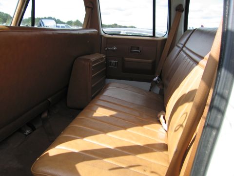 1991 Ford LTD Crown Victoria - Interior view of a vehicle, showing the rear bench seat and door paneling.