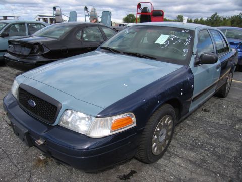 1991 Ford LTD Crown Victoria - This Ford Crown Victoria has a two-tone paint job and appears to be in a salvage yard.