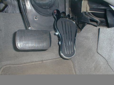 1997 Ford Taurus - Custom foot-shaped gas pedal installed in a vehicle's interior.