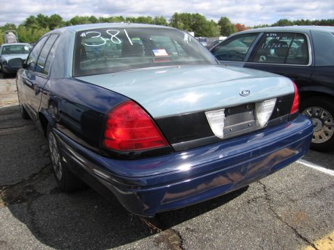 1991 Ford LTD Crown Victoria - Rear view of a two-tone Ford Crown Victoria with a number written on the rear window.