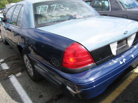 1991 Ford LTD Crown Victoria - This 1991 Ford Crown Victoria LTD is seen from the rear quarter angle, with a two-tone paint scheme and "#773" marked on the rear window.