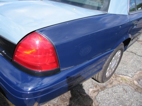1991 Ford LTD Crown Victoria - Rear view of a 1991 Ford Crown Victoria LTD showing the taillight and quarter panel.