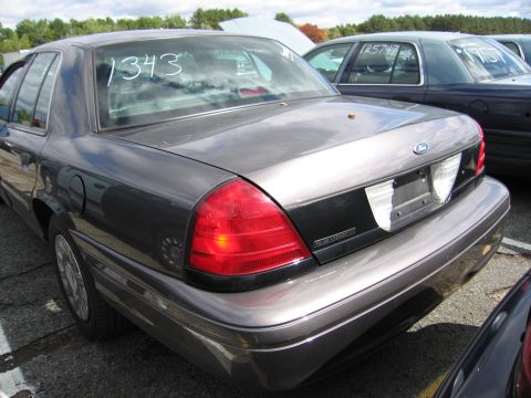 1991 Ford LTD Crown Victoria - Rear view of a 1991 Ford Crown Victoria LTD sedan, showing the taillights and trunk lid. The number '1343' is visible on the rear window.