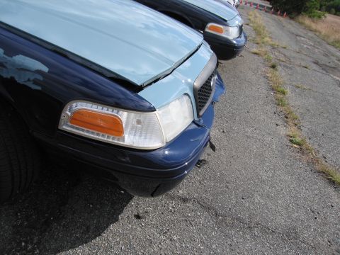 1991 Ford LTD Crown Victoria - The front end of a 1991 Ford Crown Victoria LTD is visible, with a two-tone paint scheme of light blue and dark blue.