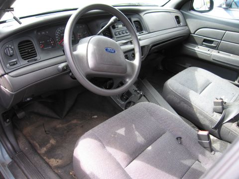 1991 Ford LTD Crown Victoria - The interior of a car, the dashboard, steering wheel, and front seats.
