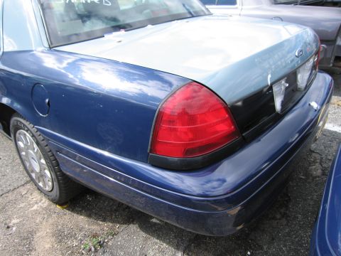 1991 Ford LTD Crown Victoria - Rear view of a blue Ford Crown Victoria showing its taillight and quarter panel.
