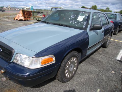 1991 Ford LTD Crown Victoria - This car has 'STATE POLICE' written on the fender and notes on the windshield.
