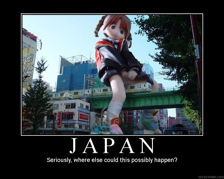 giant anime girl statue in front of buildings and a train overpass