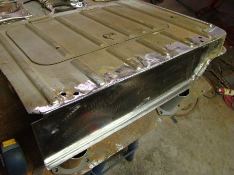 1948 Jeep Wrangler - The underside of a vehicle's floor pan is shown after undergoing metal repair and polishing.