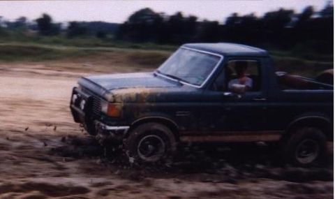 1989 Ford Bronco - This 1989 Ford Bronco is navigating a muddy off-road course.