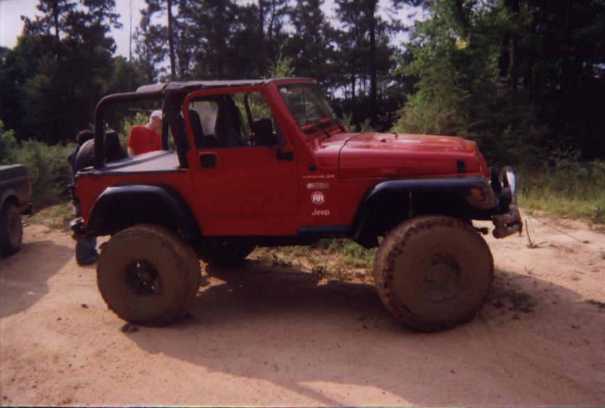 Big Red jeep, it was built for the rocks, but tried hummer hole to no avail, so i pulled him out too