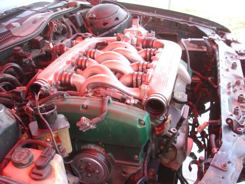 1993 Ford Taurus - Close-up view of a V6 engine's intake manifold and surrounding components.