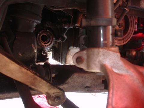 1993 Ford Taurus - Close-up view of the underside of a vehicle, showing mechanical components and suspension.