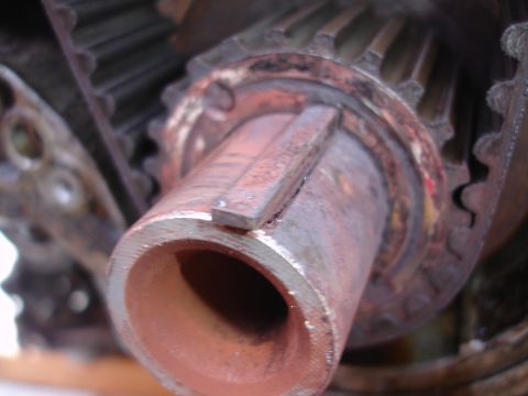 1993 Ford Taurus - Close-up view of a rusty metal shaft with a keyway, surrounded by gear teeth.