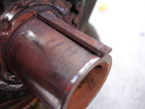 1993 Ford Taurus - This close-up shows a heavily rusted metal pipe fitting, likely a component from a vehicle's exhaust or plumbing system.