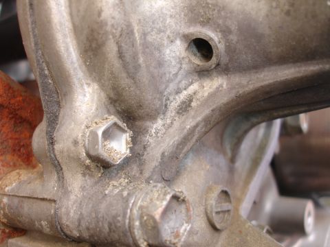 1993 Ford Taurus - A detailed view of a mechanical part, showing fasteners and a small hole.