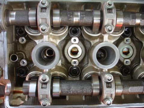 1993 Ford Taurus - Engine cylinder head components, including camshafts and valve train, are visible in this close-up view.