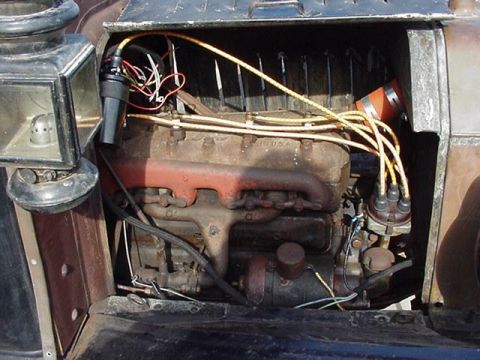 1913 Ford Model T - Close-up of a 1913 Ford Model T engine, showing the distributor and wiring.