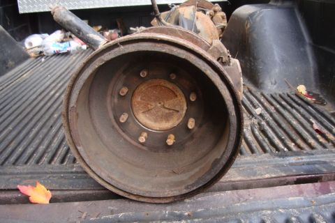 1996 Ford Bronco - A rusty rear drum brake assembly is visible in the bed of a pickup truck.