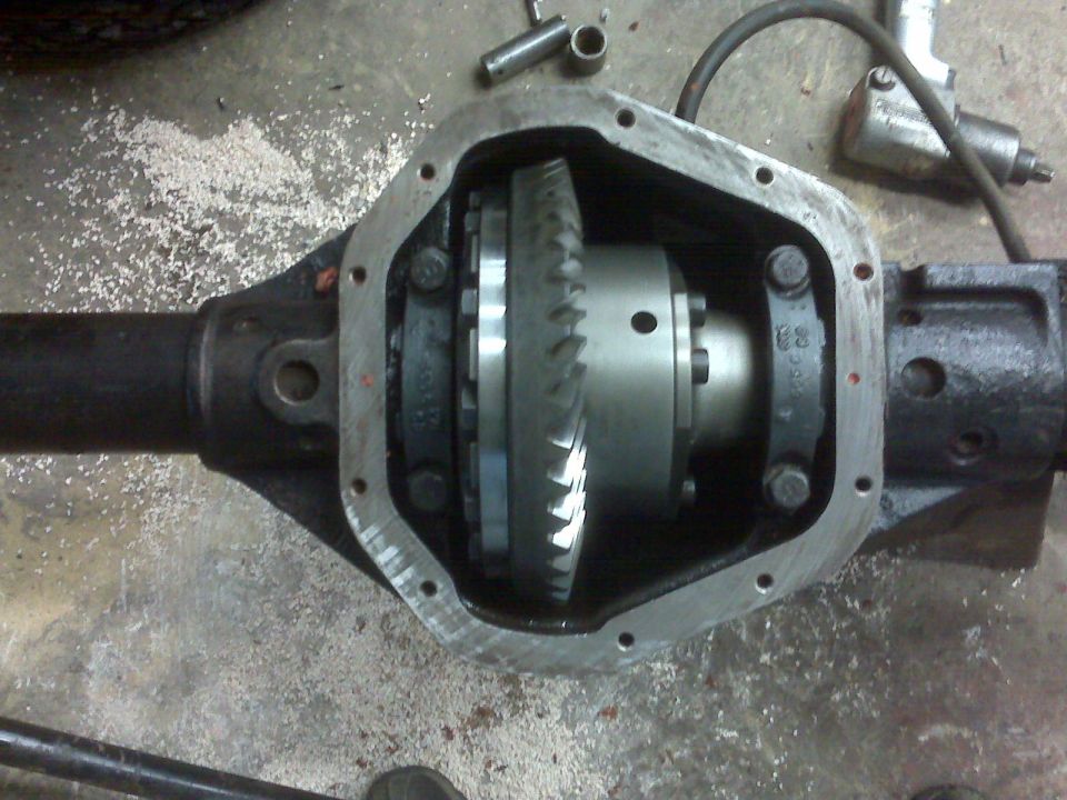 close-up of an open differential housing showing gears and internal components