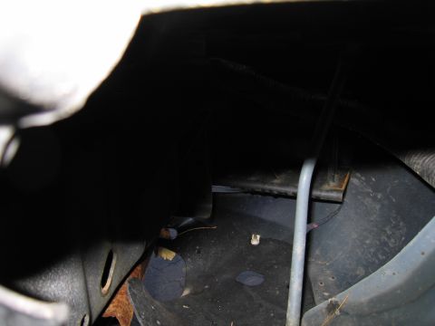 1991 Ford LTD Crown Victoria - This image shows damage to the undercarriage, with rust and debris visible.