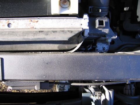 1991 Ford LTD Crown Victoria - Radiator and mounting bracket detail, showing signs of age and use.