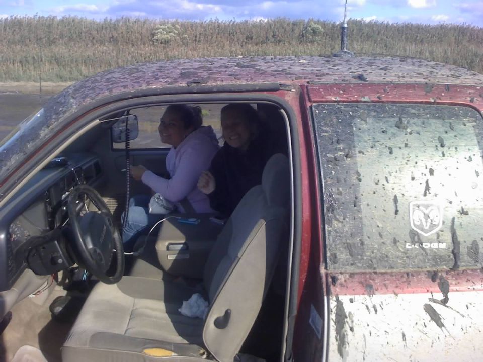 1996 Dodge 1500 interior with two women, muddy exterior