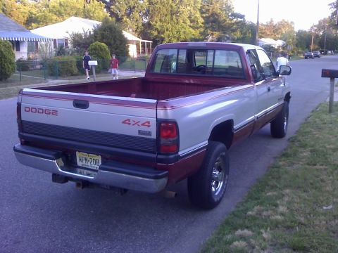 1996 Dodge 1500 - Rear view of a 1996 Dodge 1500 pickup truck with a two-tone paint scheme.