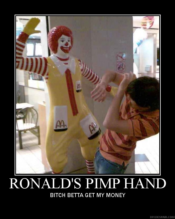 Ronald McDonald statue with a person