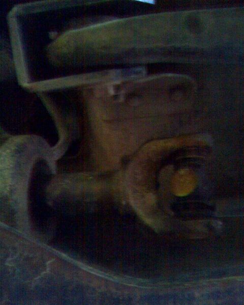 1989 Ford Bronco - Close-up of a driveshaft U-joint, likely from a vehicle's drivetrain.