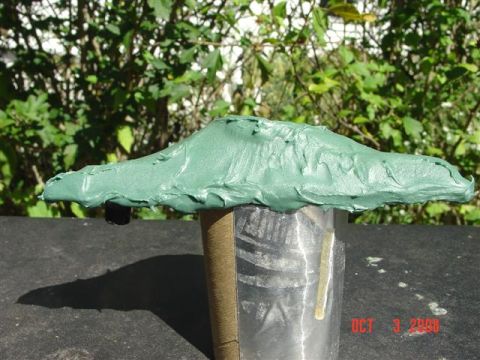 1993 Ford Probe - Green putty covers a metal cylinder, supported by a cardboard tube. Date stamp visible.