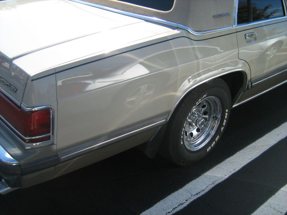 Rear quarter panel and wheel of a 1988 Mercury Grand Marquis