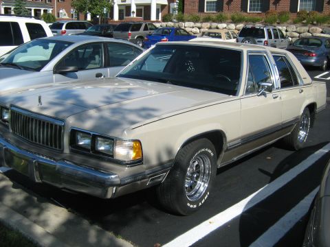 1988 Mercury Grand Marquis - This 1988 Mercury Grand Marquis sedan is seen in a parking lot with other vehicles.
