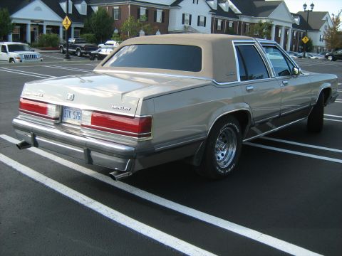 1988 Mercury Grand Marquis - Rear view of a 1988 Mercury Grand Marquis sedan parked in a lot.