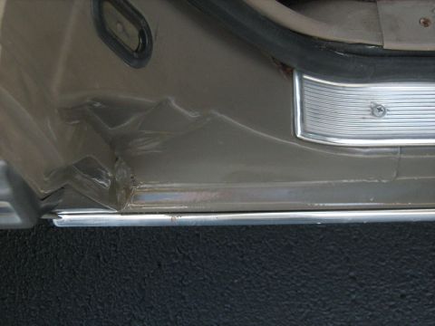 1988 Mercury Grand Marquis - Damage is visible on the interior door panel and rocker panel of this vehicle.