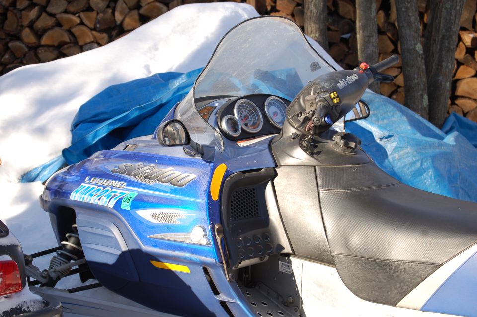 Blue Ski-Doo Legend snowmobile handlebars, gauges and windshield