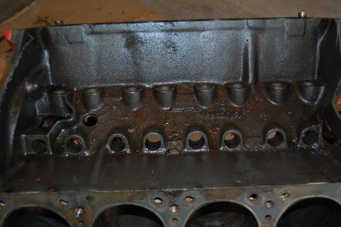 1994 Ford Bronco - This is a close-up view of an engine block, showing the internal cylinder structure and oil residue.