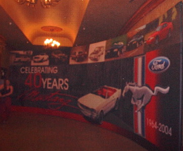 2003 Ford Mustang - A display celebrating 40 years of Ford Mustang, historical images and the iconic Mustang logo.