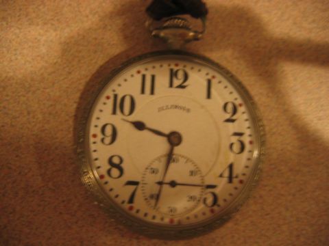 1992 Ford Bronco - Close-up of a pocket watch face with Arabic numerals and a sub-dial.